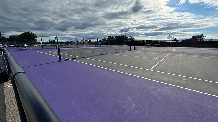 New tennis courts were added with money saved elsewhere.